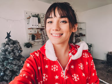 young girl in christmas pj's taking selfie in Miami apartment